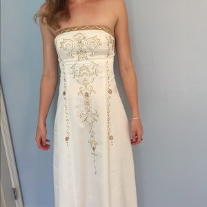 Timeless white gown with intricate gold detailing!